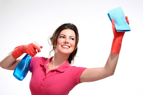 Staff member handling carpet cleaning chemicals with care